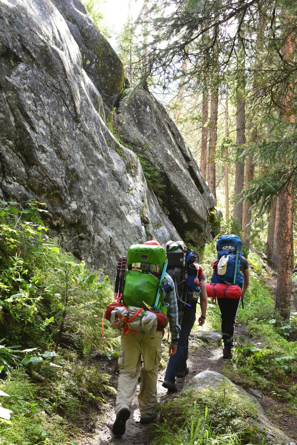 three people hiking